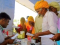 Sri Swami Madhavananda Austria Hospital in Jadan: Hospital staff issuing medicine.